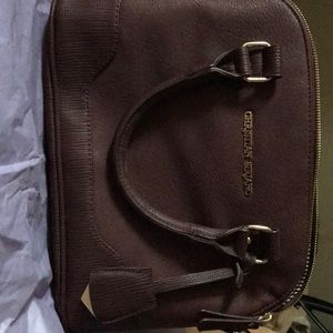 Selling a maroon Christian Sirriano purse